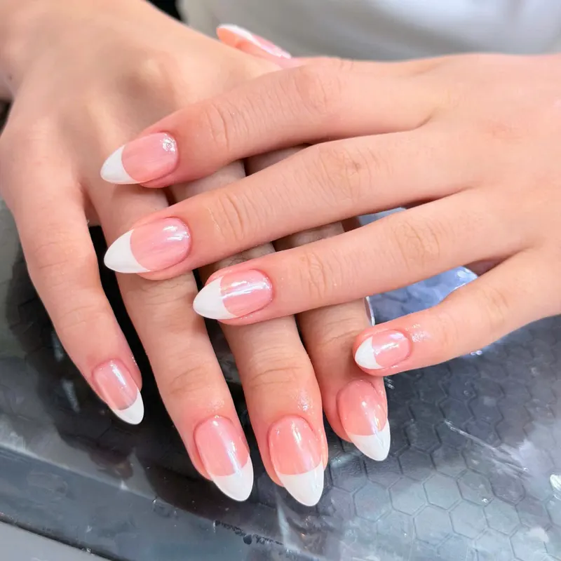 Pink and white French almond nails by LENA Nails & Beauty, nail salon in Da Nang