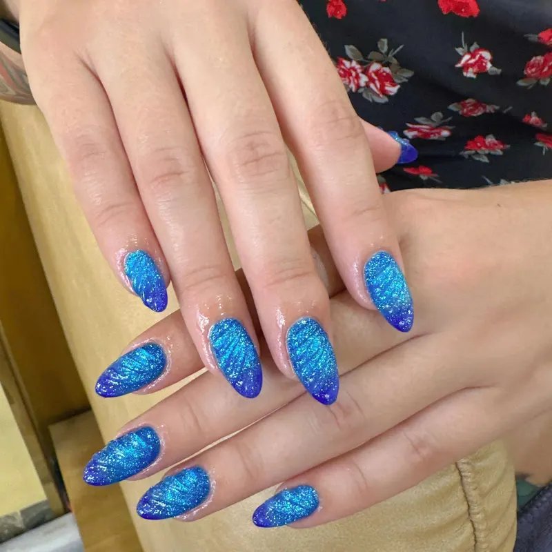 Blue glitter mermaid almond nails by LENA Nails & Beauty, nail salon in Da Nang
