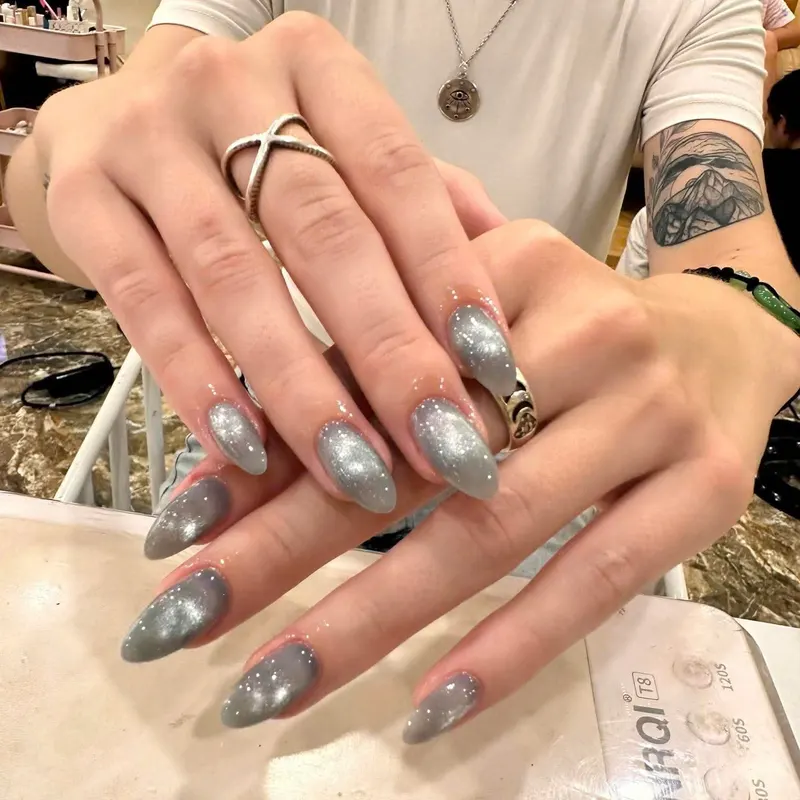 Silver chrome almond nails by LENA Nails & Beauty, nail salon in Da Nang