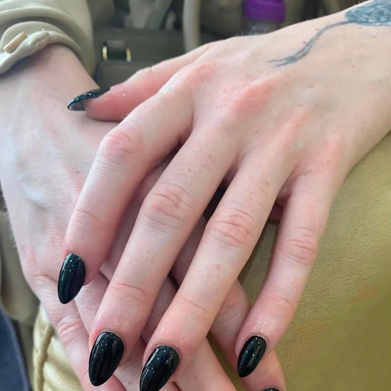 Dark green glitter almond nails by LENA Nails & Beauty, nail salon in Da Nang