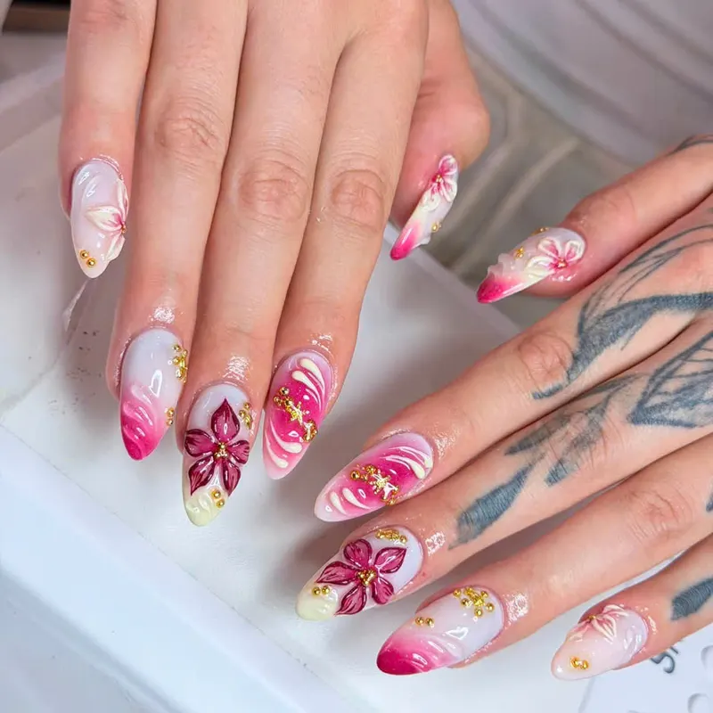 Pink nails with 3D flowers and gold beads by LENA Nails & Beauty, nail salon in Da Nang