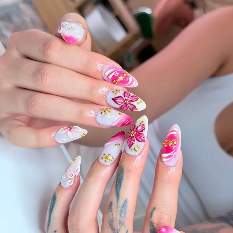White nails with pink 3D flowers and gold foil by LENA Nails & Beauty, nail salon in Da Nang