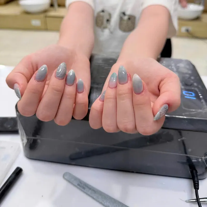 Glossy grey almond nails by LENA Nails & Beauty, nail salon in Da Nang